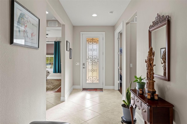 entryway featuring light tile patterned flooring