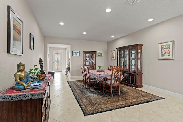 dining area with light tile patterned floors