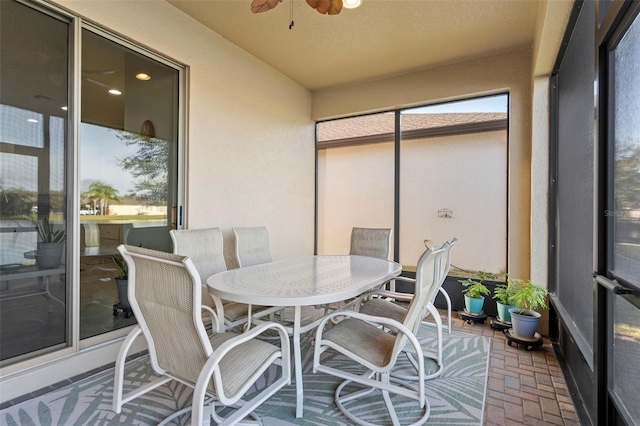 sunroom / solarium with ceiling fan