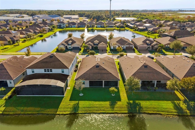 bird's eye view with a water view