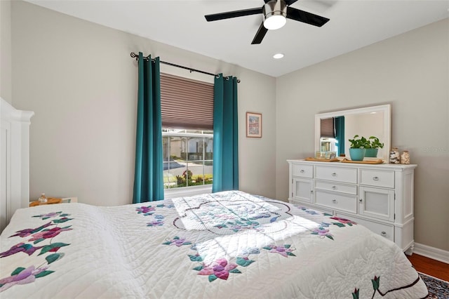 bedroom with hardwood / wood-style flooring and ceiling fan