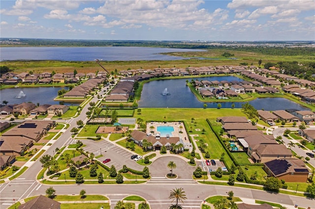 birds eye view of property with a water view