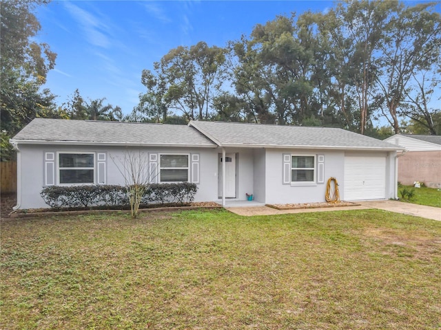 single story home with a front yard and a garage