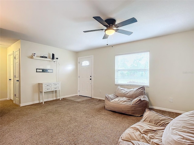 living room featuring carpet flooring and ceiling fan