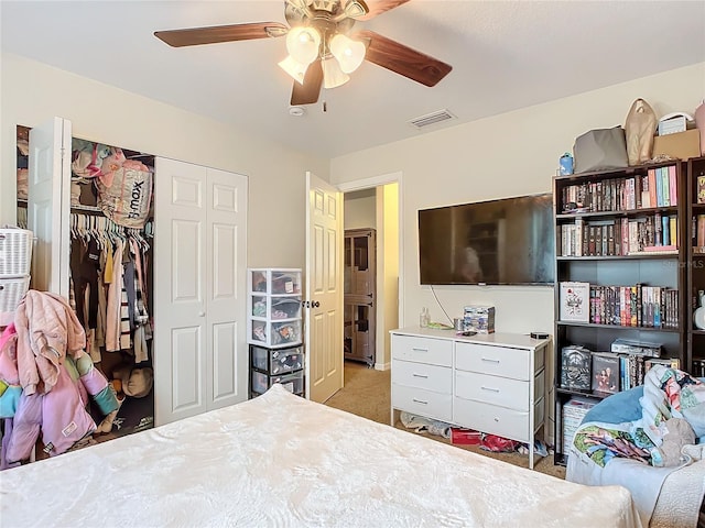 bedroom featuring ceiling fan, a closet, and carpet