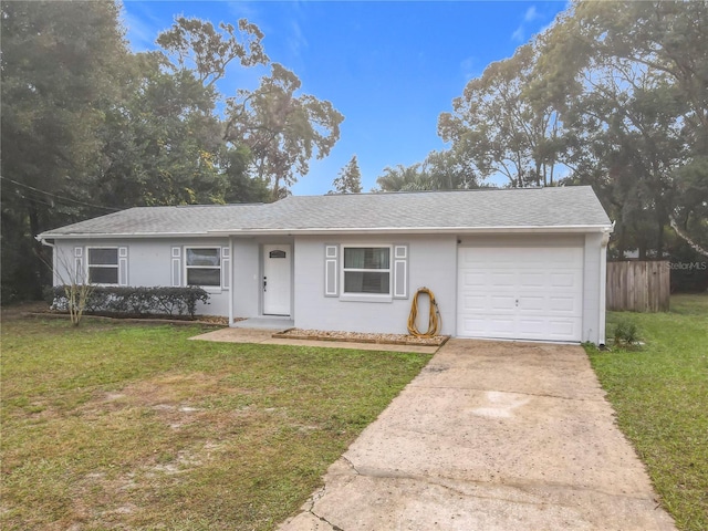 ranch-style house with a garage and a front yard