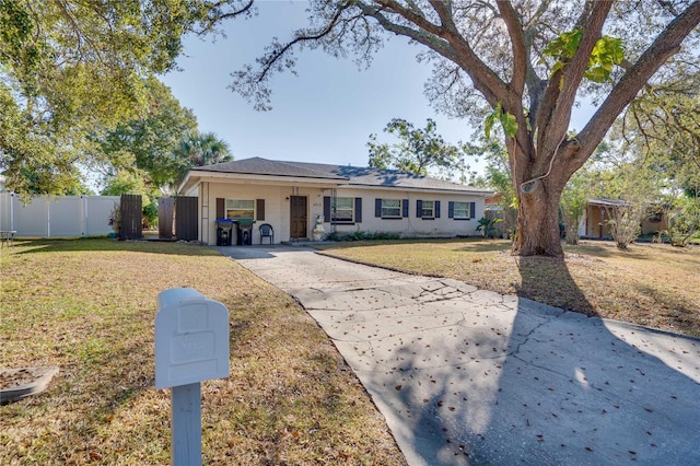 ranch-style house with a front lawn