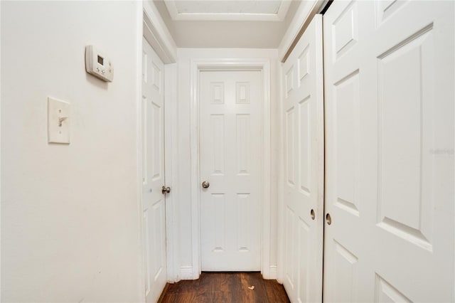corridor featuring dark wood-type flooring