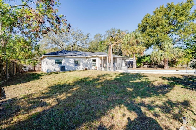 back of house with a yard