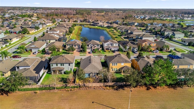 bird's eye view with a water view