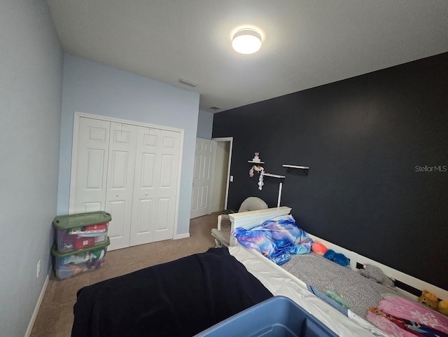 bedroom with a closet and carpet floors