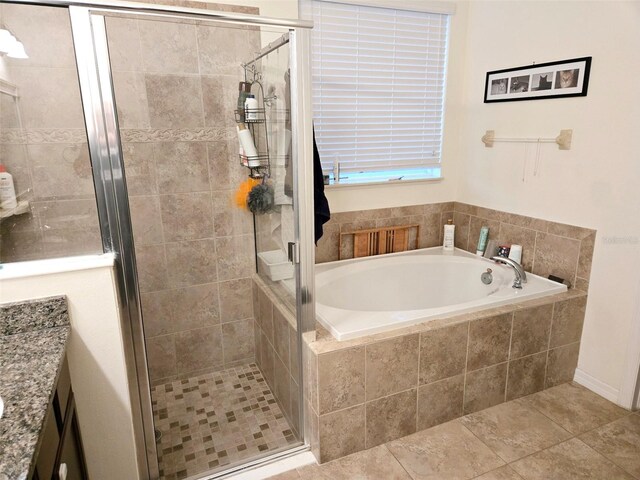 bathroom with vanity and plus walk in shower