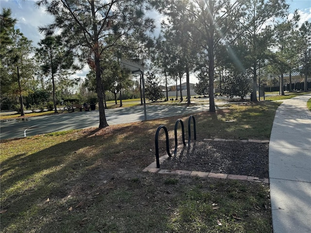 view of home's community featuring basketball court