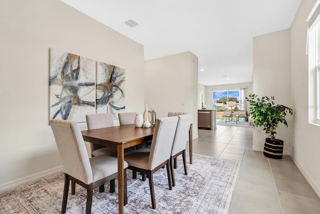 dining space with light tile patterned floors