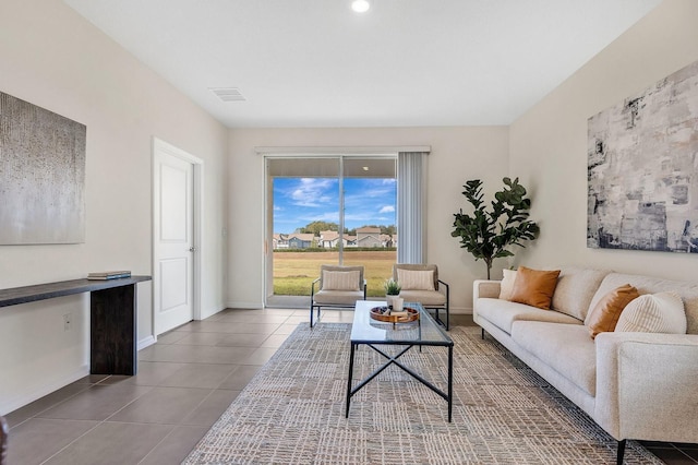 living room featuring dark tile patterned flooring