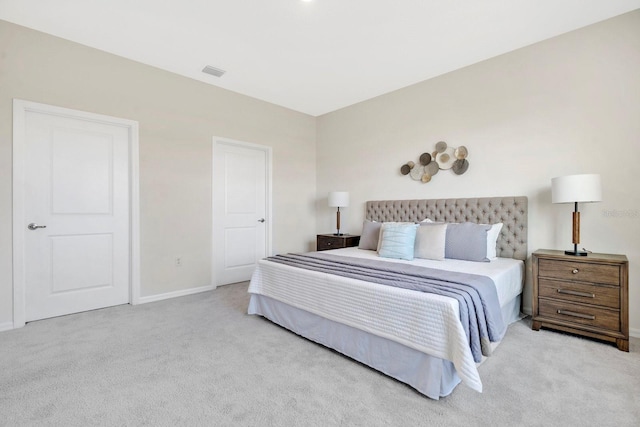 bedroom featuring light colored carpet