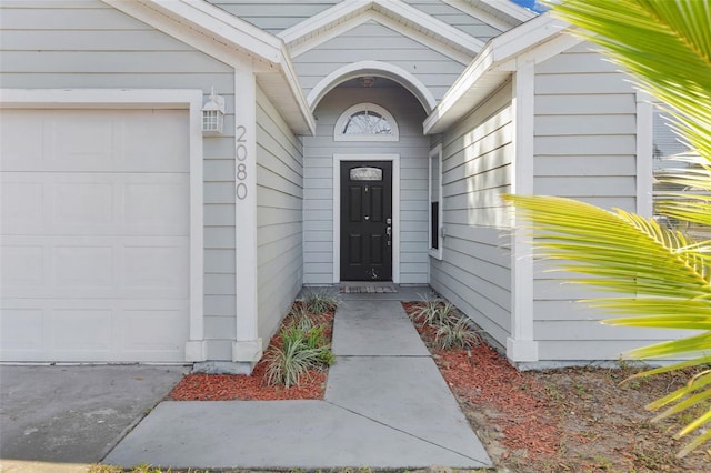 entrance to property featuring a garage