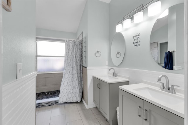 bathroom featuring a shower with shower curtain, vanity, and tile patterned flooring