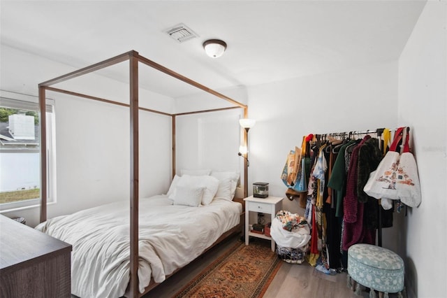 bedroom featuring wood-type flooring