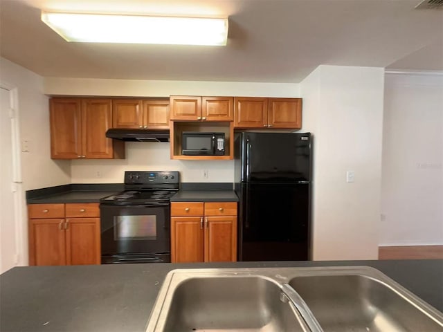 kitchen featuring sink and black appliances