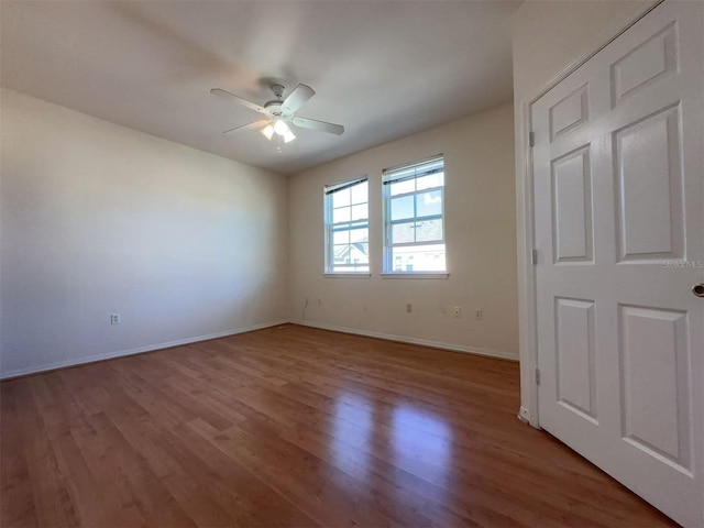 unfurnished room with wood-type flooring and ceiling fan