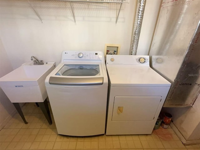 laundry room featuring separate washer and dryer and sink