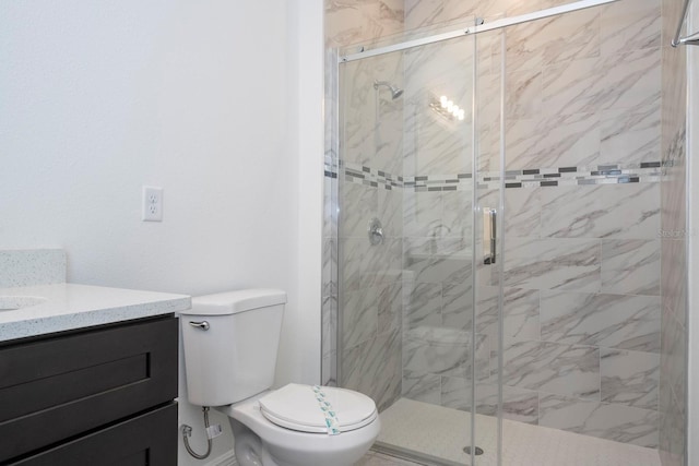 bathroom featuring vanity, toilet, and a shower with shower door