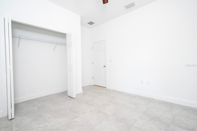 unfurnished bedroom featuring a closet and ceiling fan