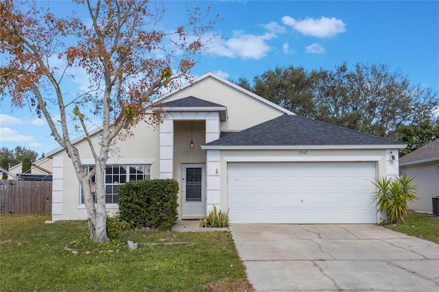 view of front of home featuring a garage and a front lawn