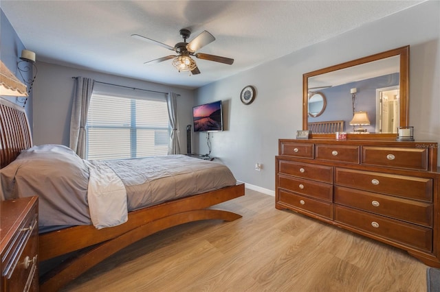 bedroom featuring light hardwood / wood-style floors and ceiling fan