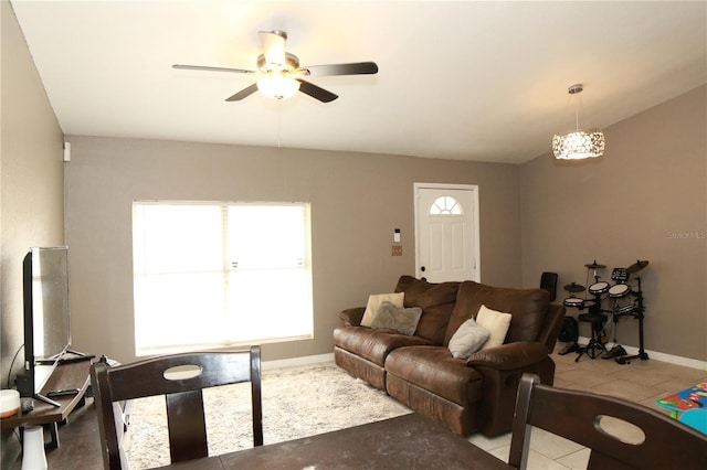 living room featuring ceiling fan and light tile patterned floors