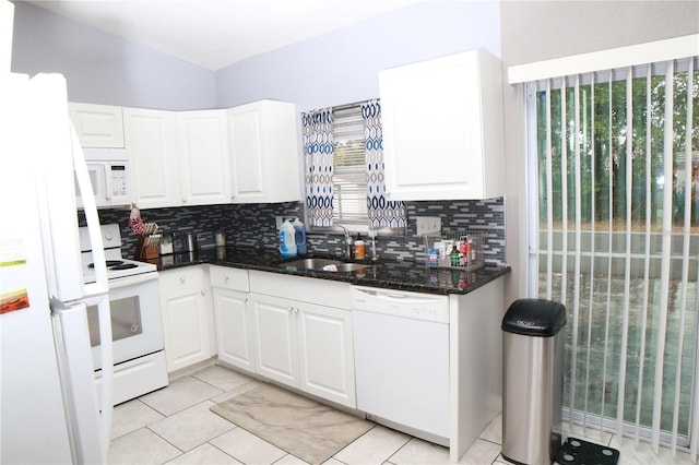 kitchen with sink, light tile patterned flooring, white appliances, decorative backsplash, and white cabinets