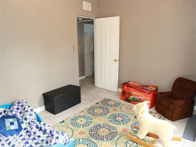 bedroom with light tile patterned floors