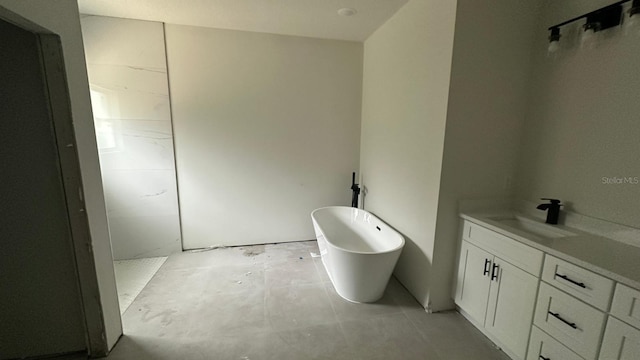 bathroom featuring vanity and a bathing tub