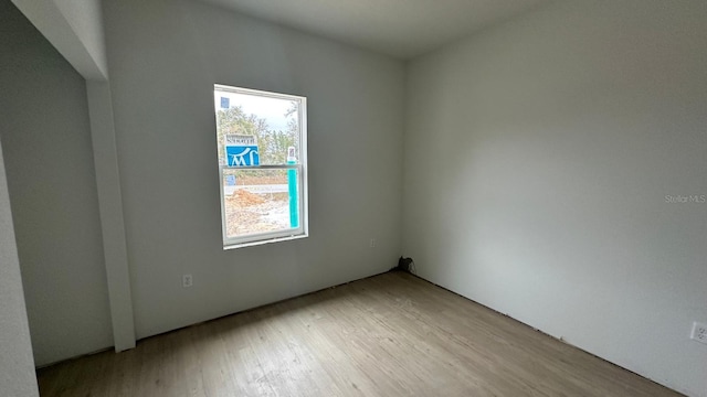 spare room with light wood-style floors