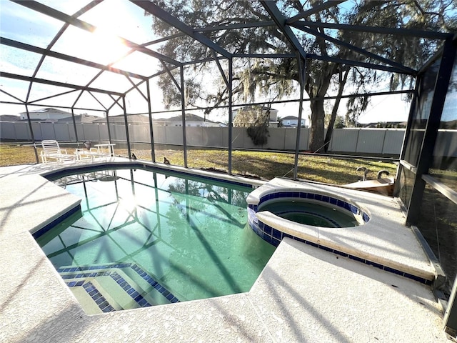 view of pool with an in ground hot tub, a patio area, and a lanai