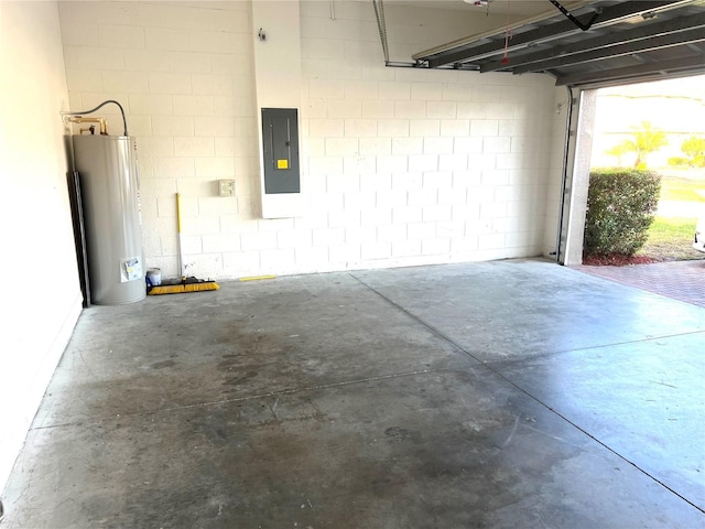 garage featuring electric panel and water heater