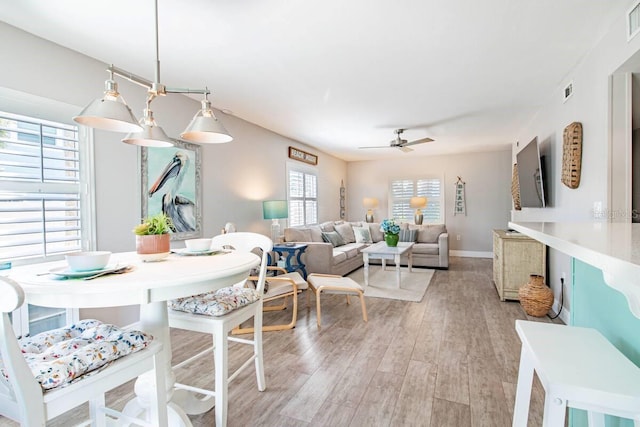 dining room featuring ceiling fan and light hardwood / wood-style floors