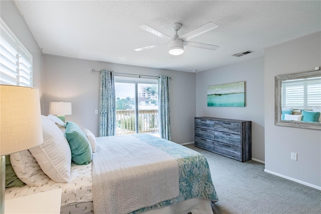 bedroom featuring carpet, a textured ceiling, access to outside, and ceiling fan