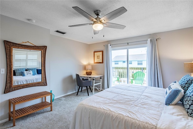 carpeted bedroom with ceiling fan, a textured ceiling, and access to outside