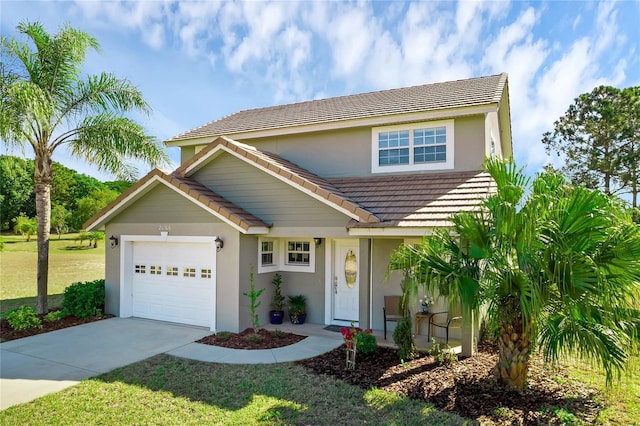 view of front of property with a front lawn and a garage