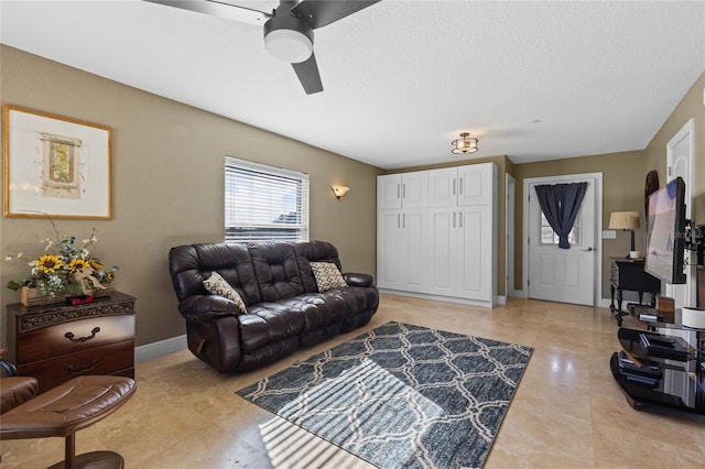 living room with ceiling fan