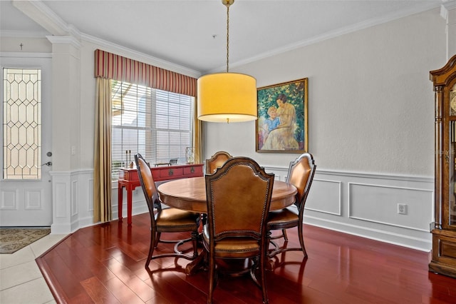 tiled dining room with ornamental molding