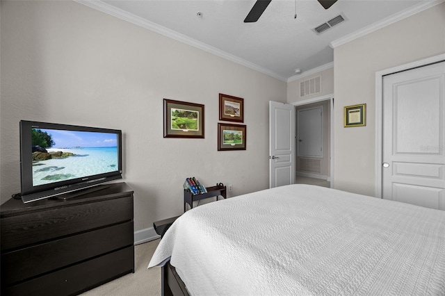 carpeted bedroom featuring ceiling fan and ornamental molding