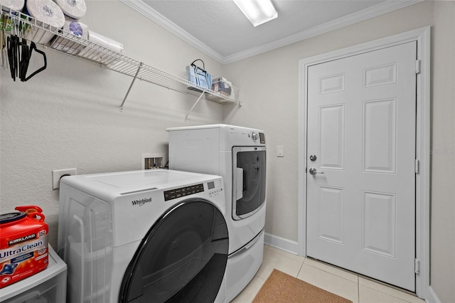 laundry room featuring separate washer and dryer, a textured ceiling, crown molding, and light tile patterned flooring