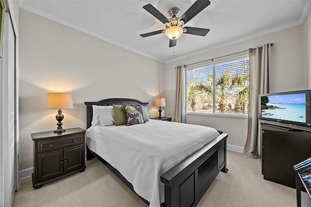 bedroom with ceiling fan, light colored carpet, and ornamental molding