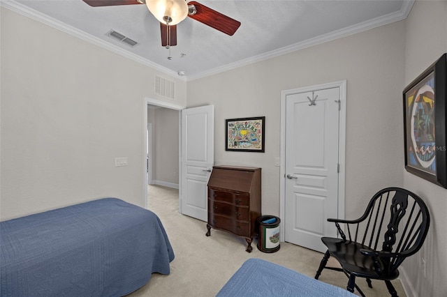 carpeted bedroom with ceiling fan and ornamental molding