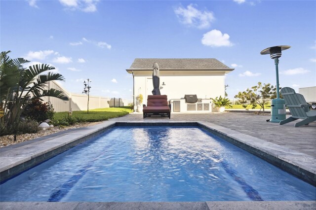 3705 Ridge Run Dr, Minneola, FL 34715 - view of pool featuring fence, a fenced in pool, a patio, and exterior kitchen