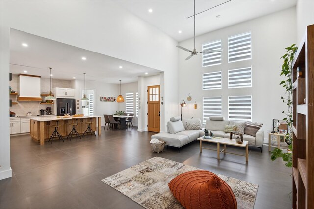 3705 Ridge Run Dr, Minneola, FL 34715 - living room with recessed lighting, a ceiling fan, and a towering ceiling