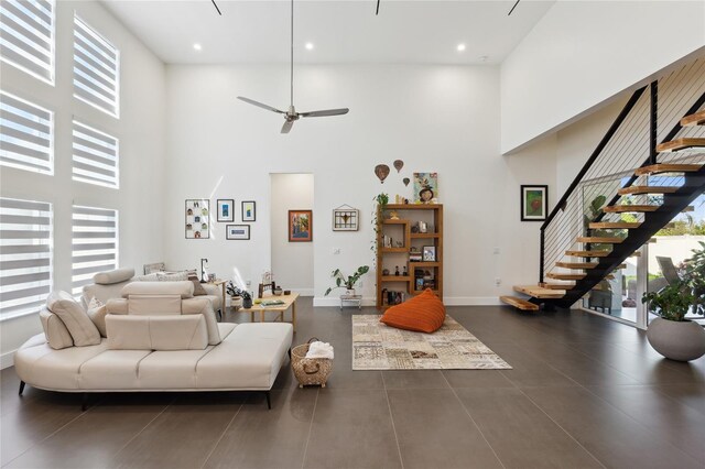 3705 Ridge Run Dr, Minneola, FL 34715 - living area featuring ceiling fan, recessed lighting, baseboards, a towering ceiling, and stairway